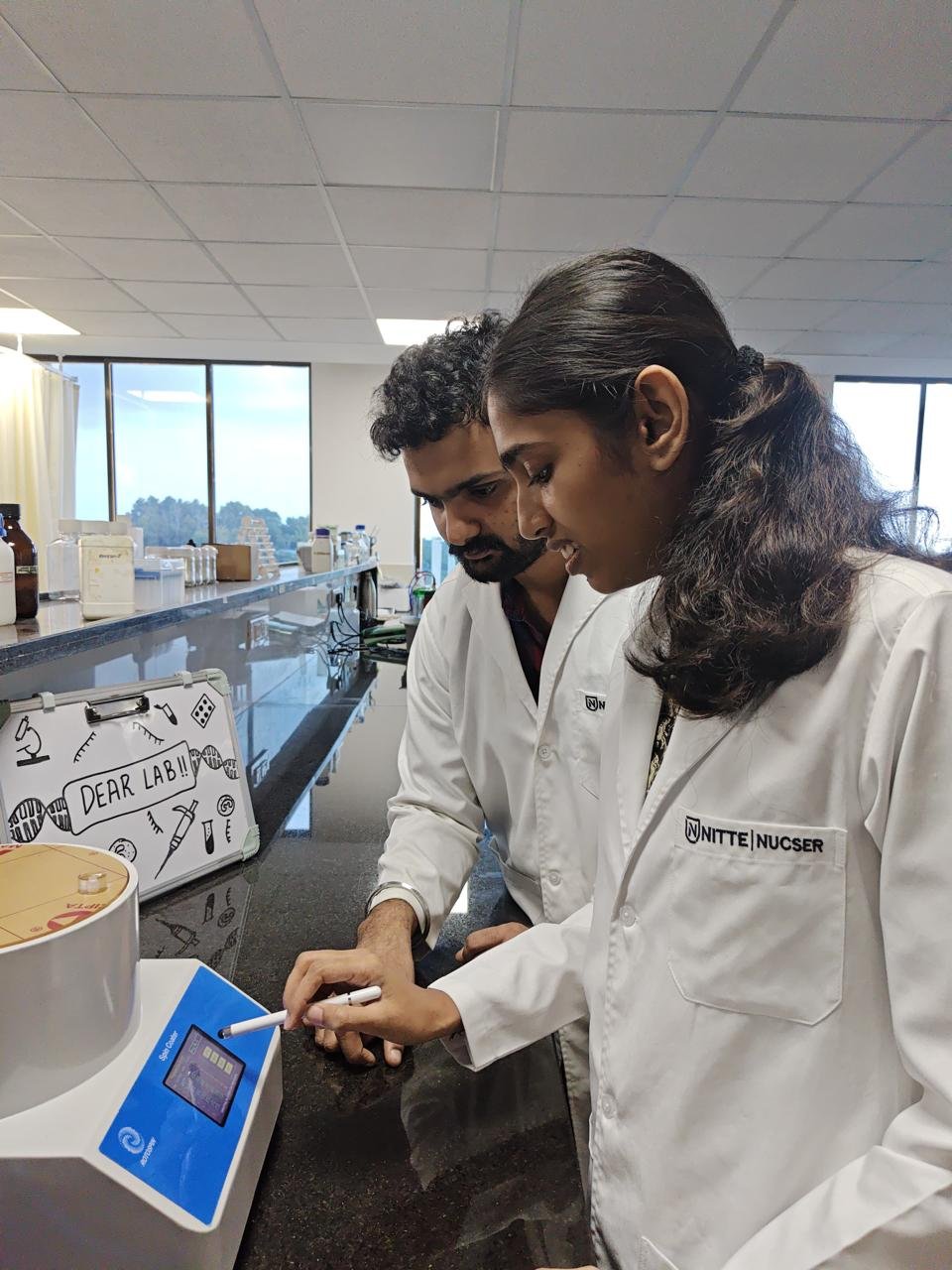 A DEAR Lab member at work on an instrument in the lab